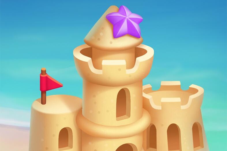 A playful sandcastle topped with a purple star
